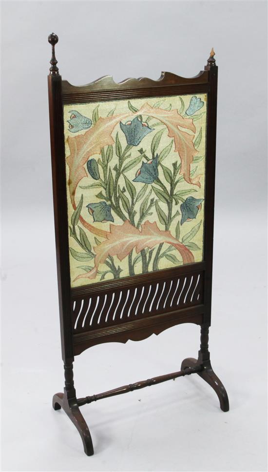 An Arts & Crafts mahogany and embroidered fire screen, by Morris & Co, late 19th century, H.3ft 8in., one finial detached